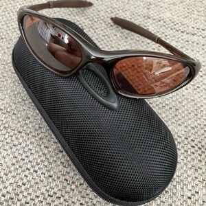 COPY - Oakley Sunglasses with bronze lens. Left lens has minor scratch.